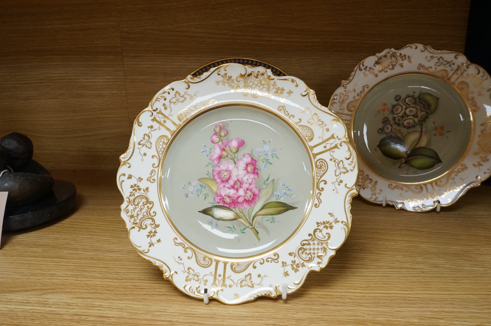 Two pairs of early 19th century porcelain botanical dishes, largest 22cm in diameter